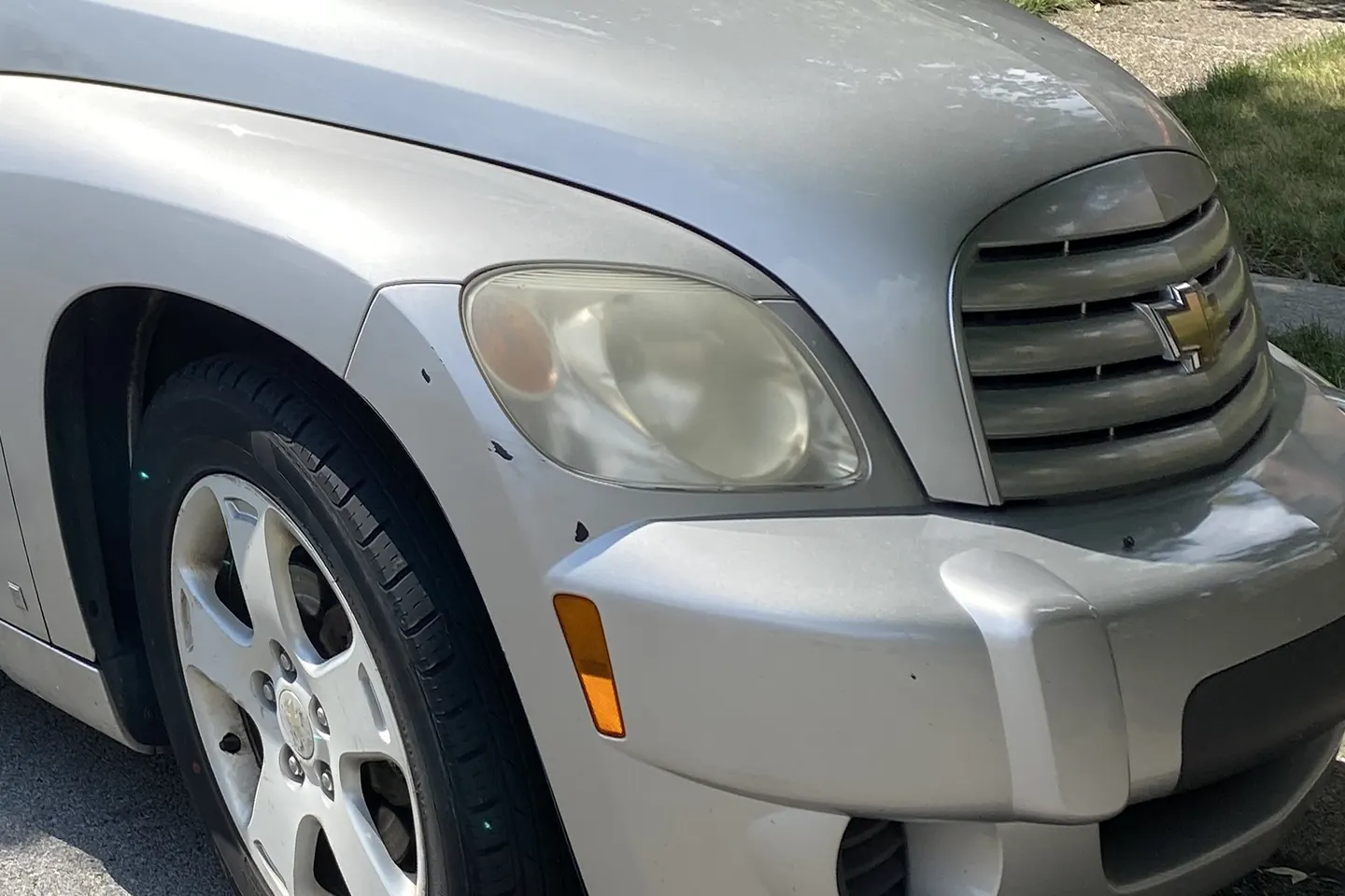 Sample photo: the front corner of an undamaged silver Chevrolet HHR.